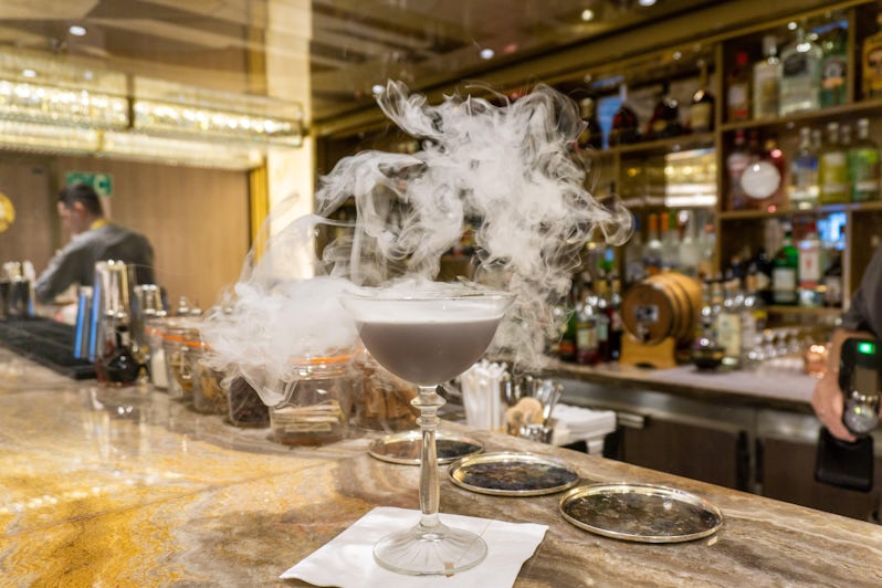 Smoke billows from a cocktail in The Founders Bar aboard Oceania's Vista (Photo: Aaron Saunders)