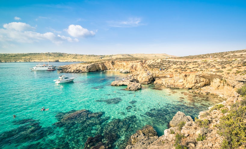 People Snorkeling in the Blue Lagoon in Comino Island, the Mediterranean Natural Wonder in the Beautiful Malta (Photo: View Apart/Shutterstock)