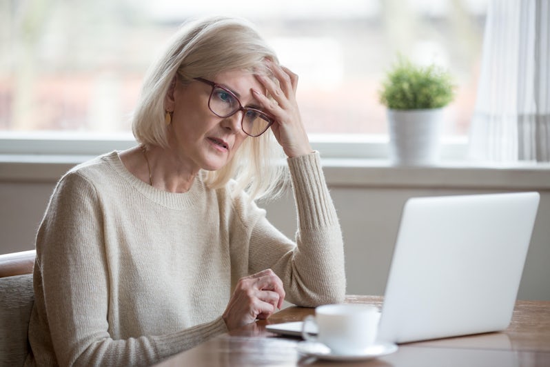 Frustrated worried senior middle aged female reading bad email news (Photo: fizkes/Shutterstock)
