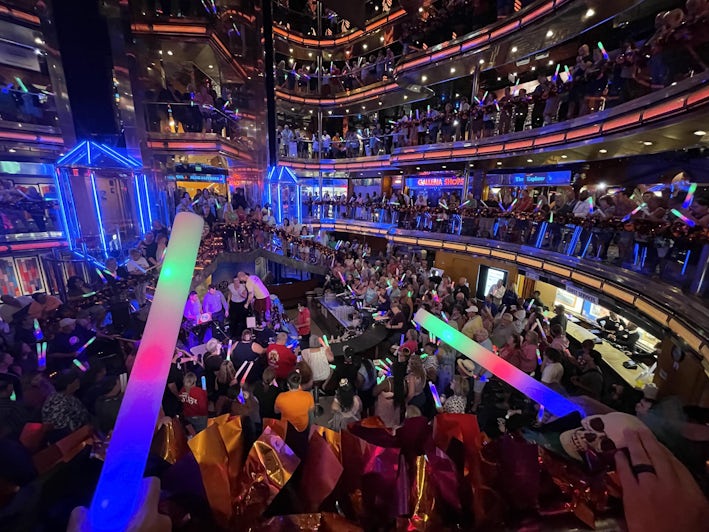 Fun Ship Farewell: Passengers celebrate Carnival Ecstasy's last voyage in the ship's atrium. (Photo: Peter Knego)