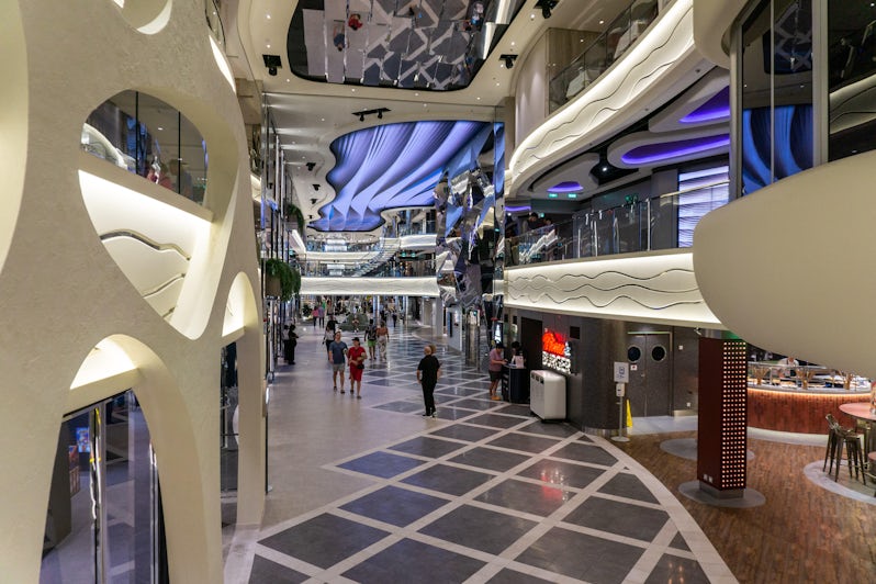 An interior promenade runs from the bow to midship stair towers along Decks 6. 7 and 8 aboard MSC World Europa (Photo: Aaron Saunders)