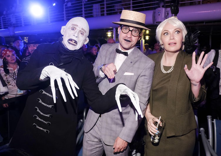 A passengers dressed up as Nosferatu, Dave Karger dressed up as silent comic Harold Lloyd and Alicia Malone dressed up as Tippi Hedren in "The Birds"
