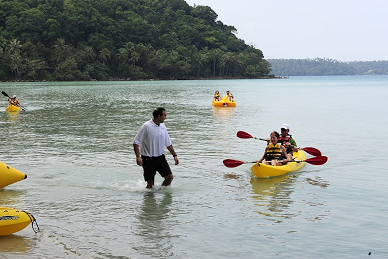 Seabourn passengers kayaking by the shore