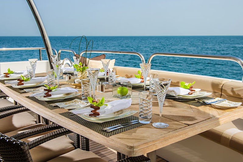 Dinning table on the upper deck in luxurious yacht