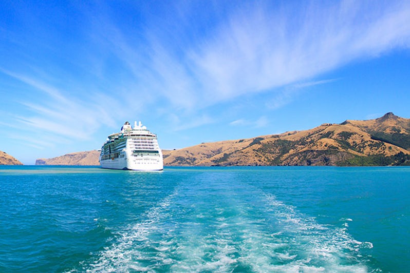 Panoramic view from the banks of Akaroa at the ship anchored nearby