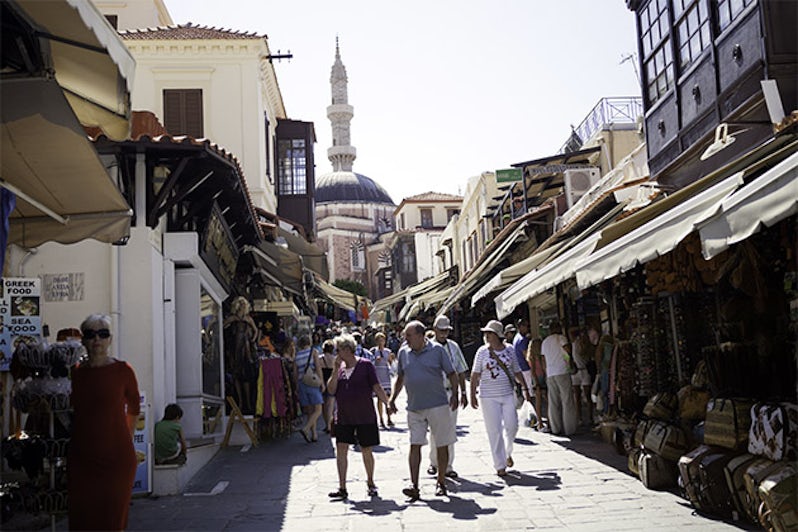 Azamara passengers walking through the Old Town of Rhodes in Greece