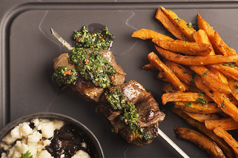 Steak kebabs and sweet potato fries from Crystal Serenity's evening menu