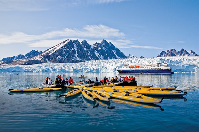 National Geographic Explorer passengers kayaking near Spitsbergen Island