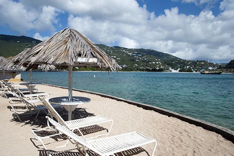 Empty beach chairs in front of Lindbergh Bay on St. Thomas