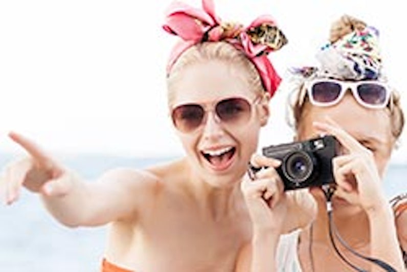 Friends taking a picture - photo courtesy of Nikkolia/Shutterstock
