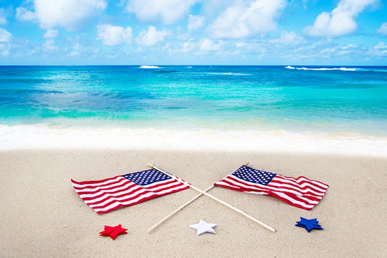 American flags laid out on a beach