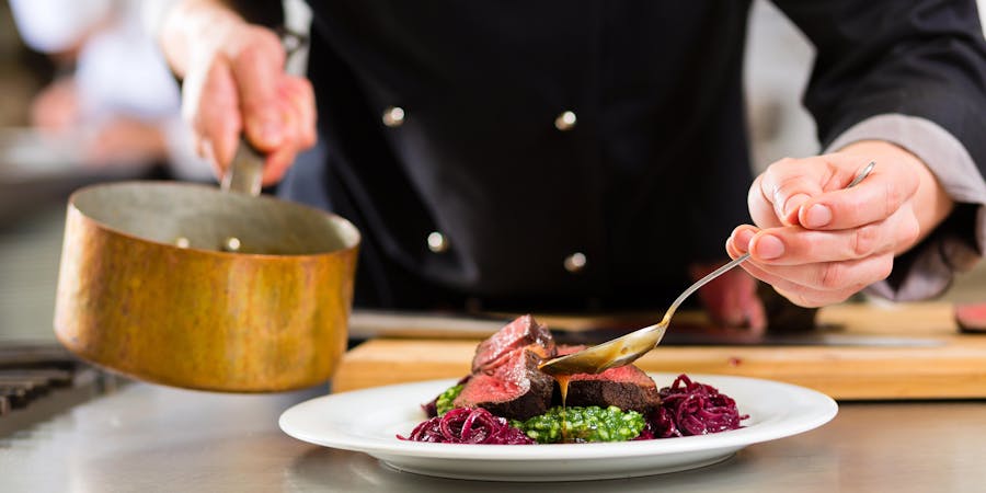 Chef Preparing a Meal (Photo: Kzenon/Shutterstock) Chef Preparing a Meal (Photo: Kzenon/Shutterstock)