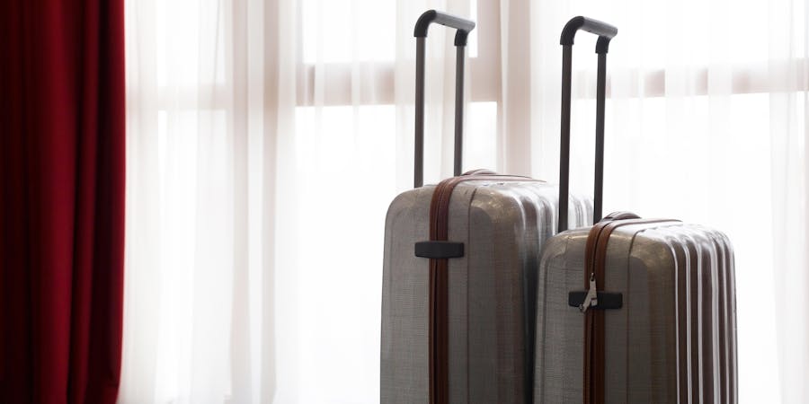 Suitcases Near Window (Photo: FabrikaSimf/Shutterstock) Suitcases Near Window (Photo: FabrikaSimf/Shutterstock)