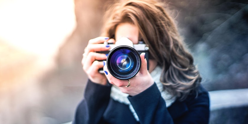 Women Photographing Subject With Digital Camera (Photo: hispan/Shutterstock)