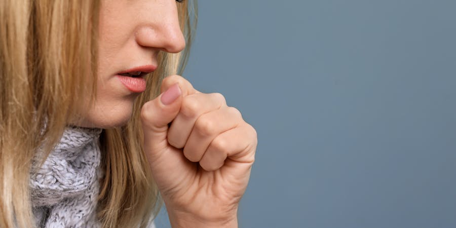 Young Woman Coughing (Photo: New Africa/Shutterstock) Young Woman Coughing (Photo: New Africa/Shutterstock)