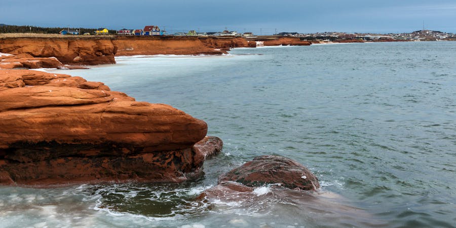 Red Cliffs on Cape-aux-Meules Island, Quebec, Canada (Photo: Richard Cavalleri/Shutterstock) Red Cliffs on Cape-aux-Meules Island, Quebec, Canada (Photo: Richard Cavalleri/Shutterstock)