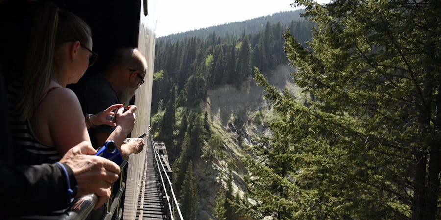Passengers Photograph a Canyon During a Narrow Overpass on the Rocky Mountaineer Train (Photo: Christina Janansky/Cruise Critic) Passengers Photograph a Canyon During a Narrow Overpass on the Rocky Mountaineer Train (Photo: Christina Janansky/Cruise Critic)