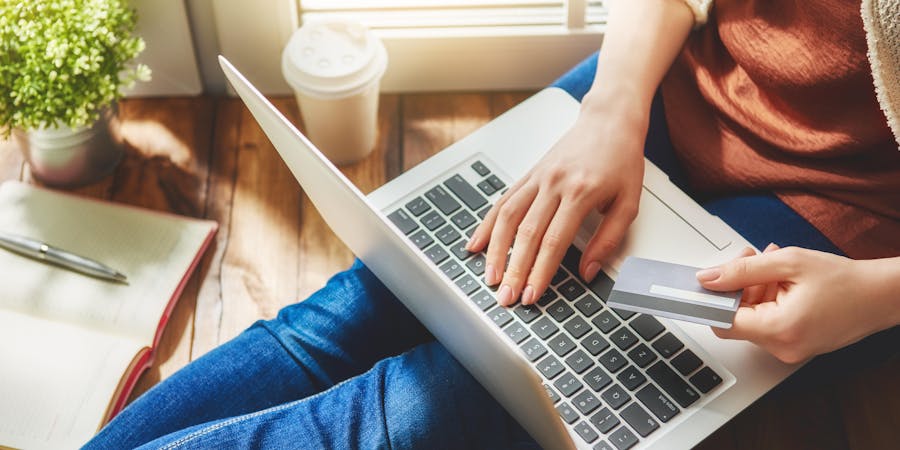 Woman Paying for Cruise Online (Photo: Yuganov Konstantin/Shutterstock) Woman Paying for Cruise Online (Photo: Yuganov Konstantin/Shutterstock)