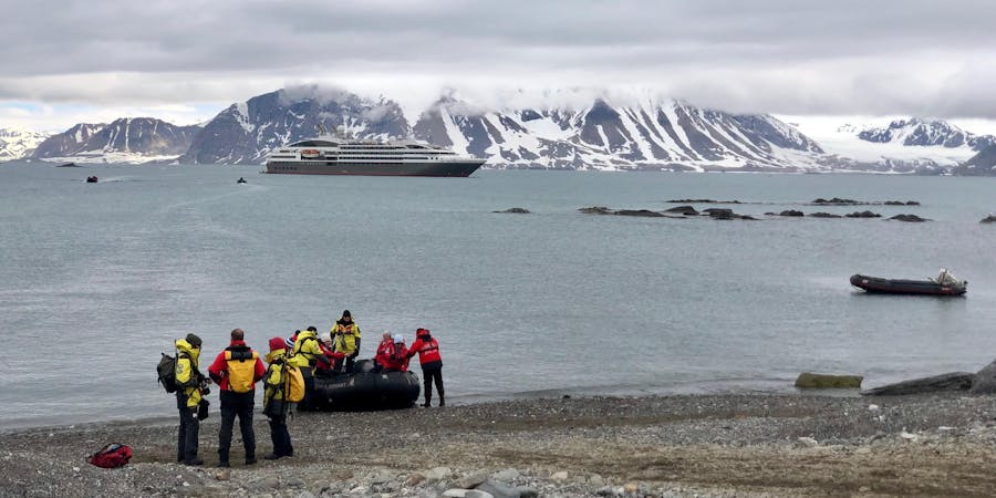Expedition staff from Ponant’s ship Le Boreal help cruisers off the Zodiac in Svalbard (Photo: Chris Gray Faust ) Expedition staff from Ponant’s ship Le Boreal help cruisers off the Zodiac in Svalbard (Photo: Chris Gray Faust )