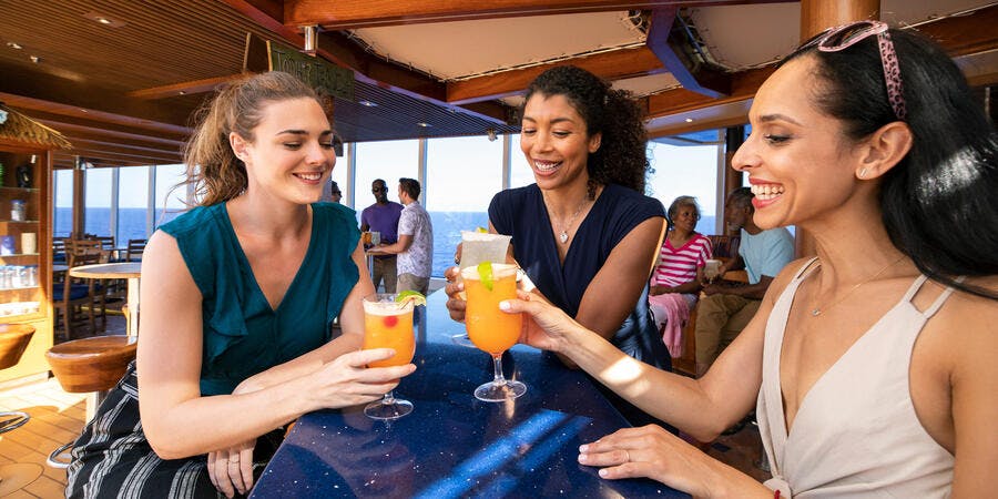 Friends drinking on a Carnival ship (Photo: Carnival Cruise Line) Friends drinking on a Carnival ship (Photo: Carnival Cruise Line)