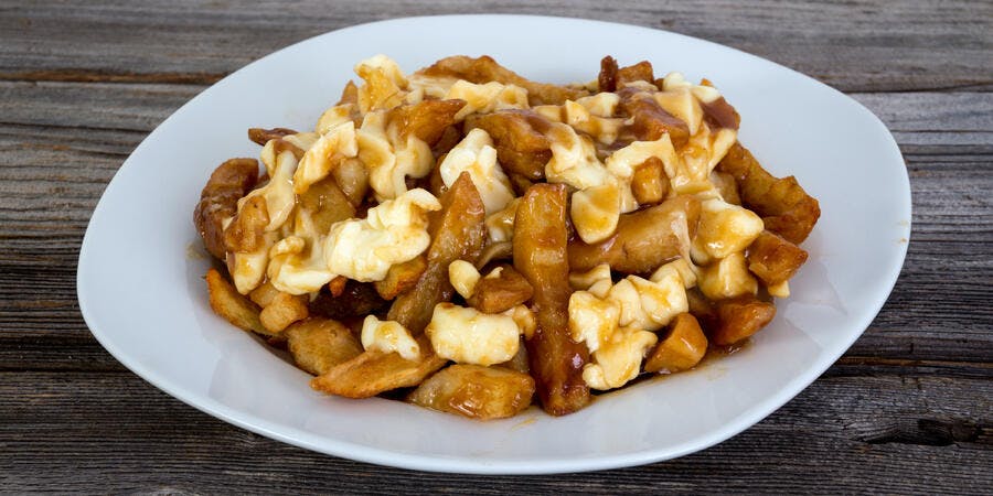 Quebec's Delicacy Poutine Which is Gravy and Fries (Photo: julie deshaies/Shutterstock) Quebec's Delicacy Poutine Which is Gravy and Fries (Photo: julie deshaies/Shutterstock)