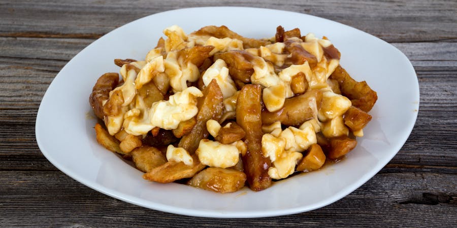 Quebec's Delicacy Poutine Which is Gravy and Fries (Photo: julie deshaies/Shutterstock) Quebec's Delicacy Poutine Which is Gravy and Fries (Photo: julie deshaies/Shutterstock)