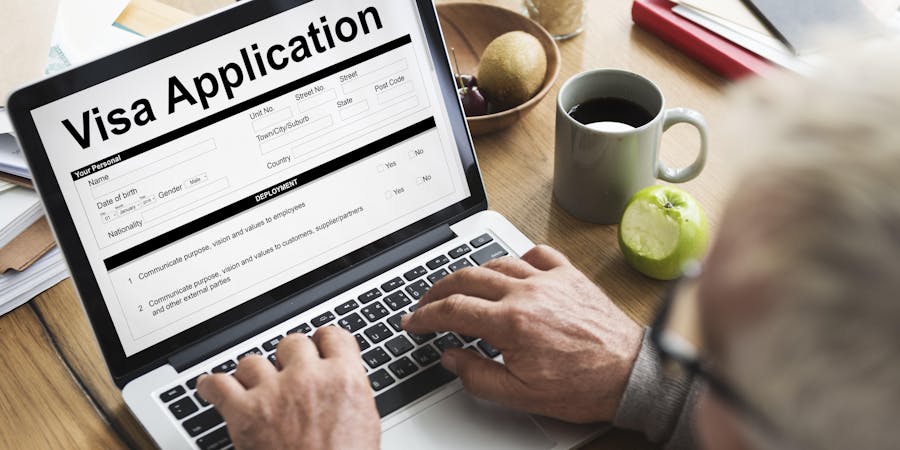 Man Filling out Online Visa Application (Photo: Rawpixel.com/Shutterstock) Man Filling out Online Visa Application (Photo: Rawpixel.com/Shutterstock)