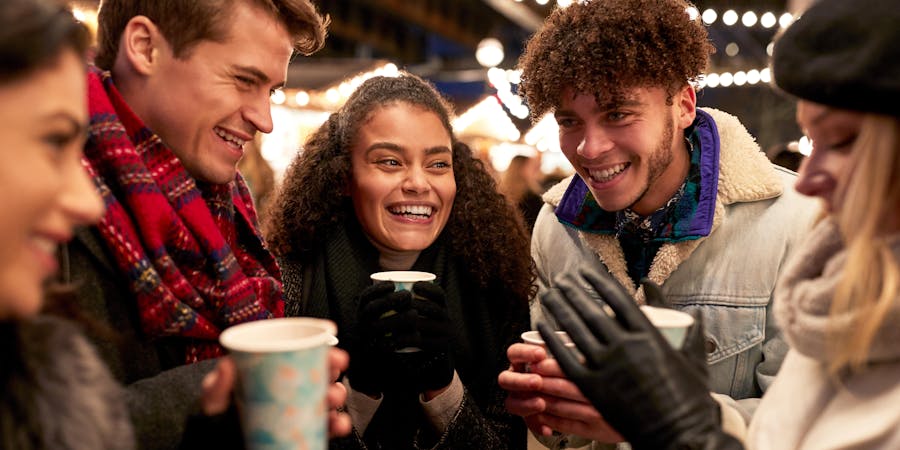 Friends Socializing in the Christmas Market (Photo: Monkey Business Images/Shutterstock) Friends Socializing in the Christmas Market (Photo: Monkey Business Images/Shutterstock)