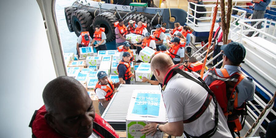 Symphony of the Seas' crew members unloading relief supplies and meals for distribution at Grand Bahama (Photo: Royal Caribbean) Symphony of the Seas' crew members unloading relief supplies and meals for distribution at Grand Bahama (Photo: Royal Caribbean)