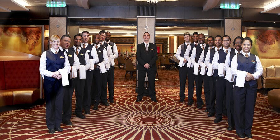 Main Dining Room Service Staff on Allure of the Seas (Photo: Royal Caribbean International) Main Dining Room Service Staff on Allure of the Seas (Photo: Royal Caribbean International)