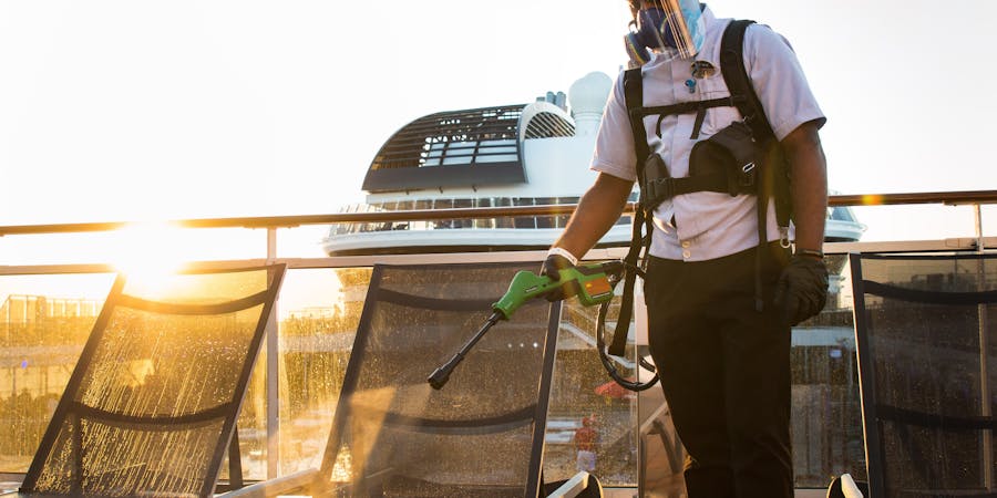 Crew member electrostatic spraying pool loungers (Photo: MSC Cruises) Crew member electrostatic spraying pool loungers (Photo: MSC Cruises)