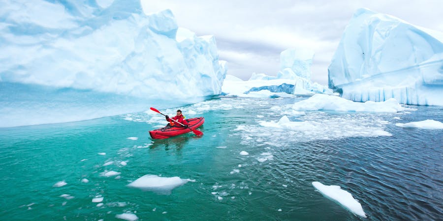 Man Kayaking Near the Icebergs in Antarctica (Photo: Song_about_summer/Shutterstock) Man Kayaking Near the Icebergs in Antarctica (Photo: Song_about_summer/Shutterstock)