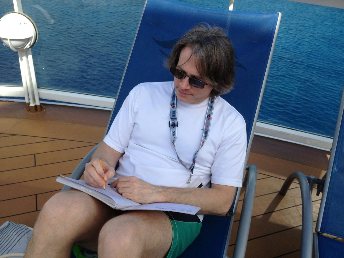 John wring lyrics for his new CD (aat Castaway Cay)