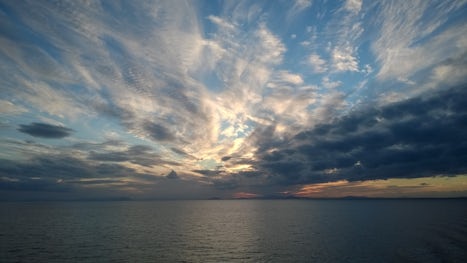 Sunset over Sardinia; Day at Sea