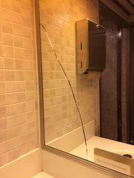 Broken mirror in men's toilets Lido deck