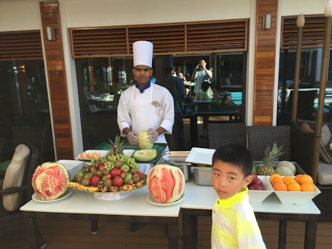 Chef cut and slice fruit on sea day, breakfast in haven courtyard