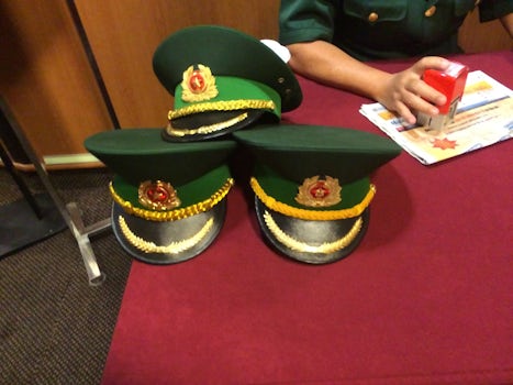 Soldiers hats as they were checking documents as we exited the ship in HCMC,