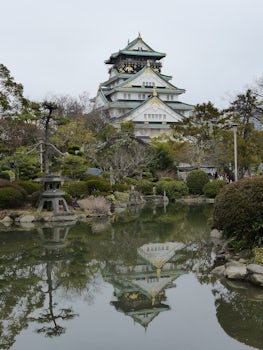 Osaka Castle, reflected in the pond of the beautiful Japanese Garden.