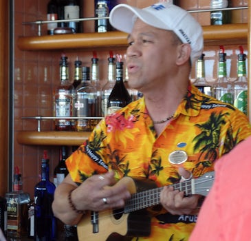 Talented Bartender serenading lucky passengers at the aft pool