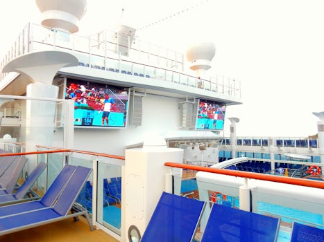 Two screens above pool; they played soccer way too much, but when  a movie