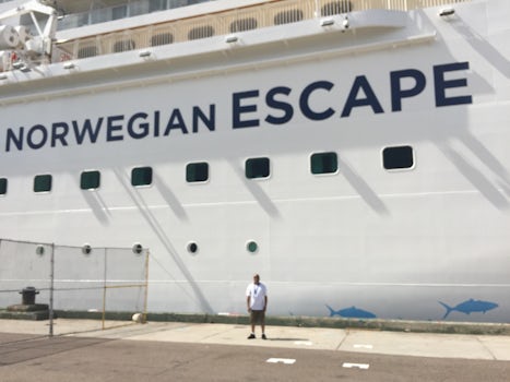 The NCL Escape cruise ship.  My husband in the foreground.
