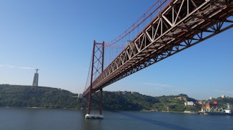The entrance to Lisbon Harbor under the suspension bridge that is the sister of the Golden Gate Bridge, both built by US Steel