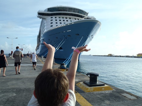 Grandson holding up ship