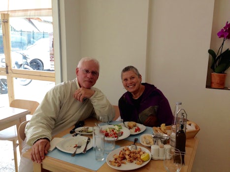 Lunch in Corfu on the walking food tour. Greek salad, calamari, egg fish dish