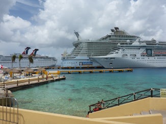 cozumel next to the biggest ship in the fleet (oasis) and us ha ha ha