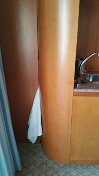 A towel stuffed between the room divider to stop vibrations