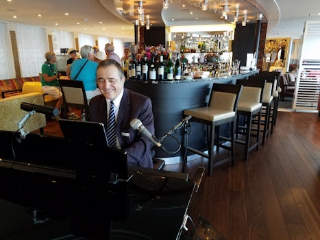 On-board pianist/singer who gave music several times during day and evening
