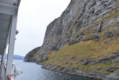 Finnmarken passing close to Haja Is, Hammerfest, largest free standing rock
