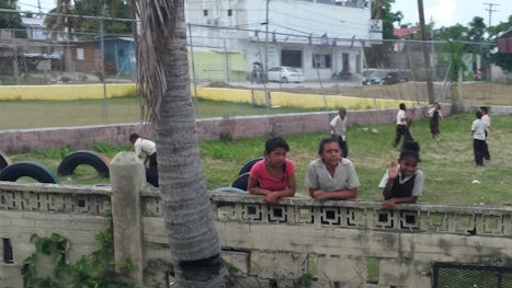 Belize, kids watching the traffic go by.