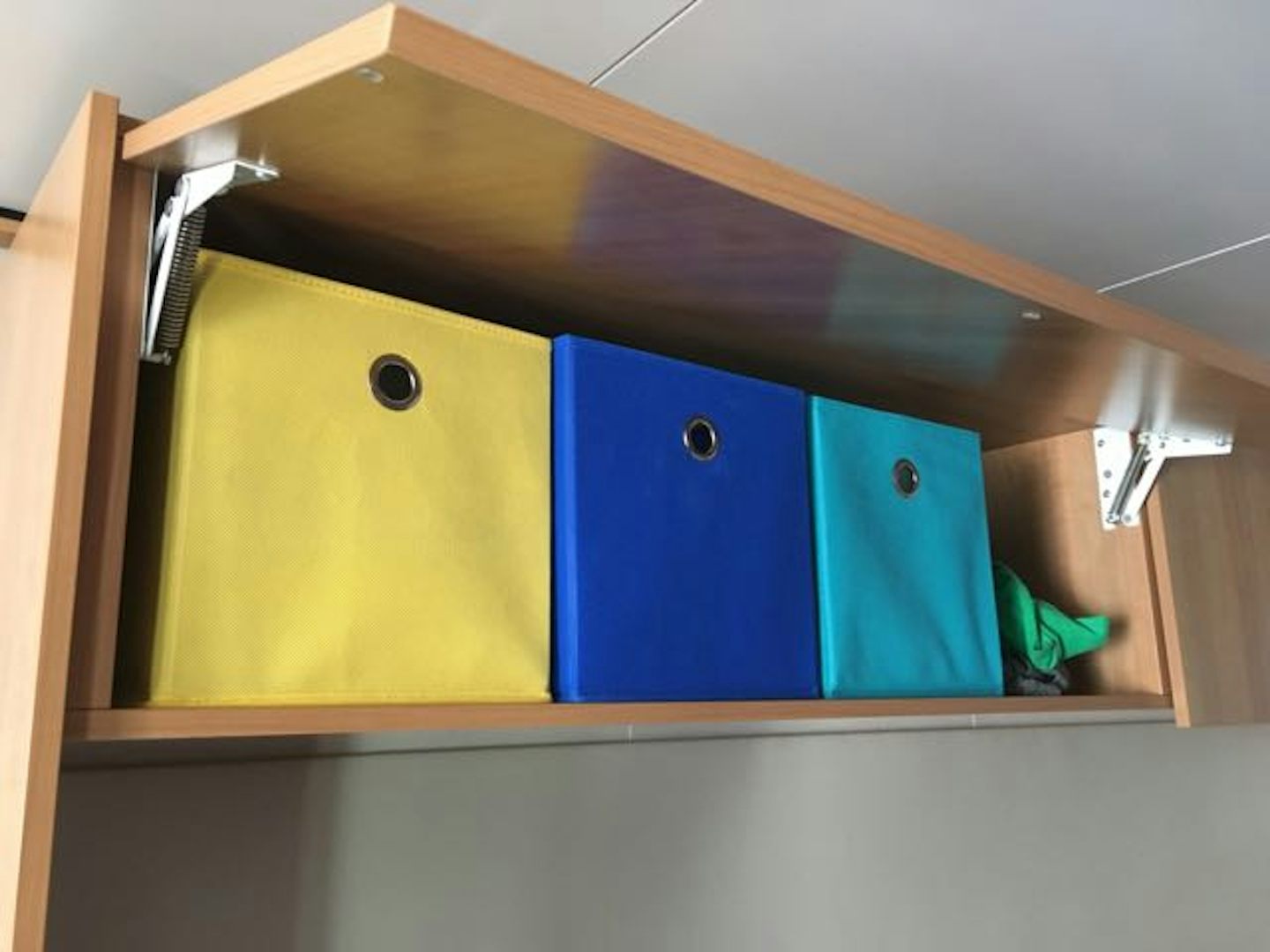 12x12 collapsable cubes make great extra storage bins above the bed.